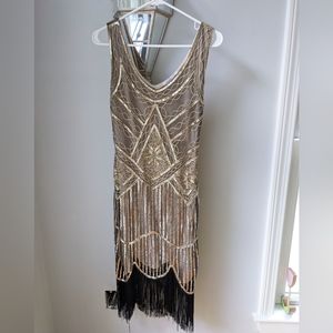 Women's flapper dress. Gold with black fringe. Size small. Worn once.